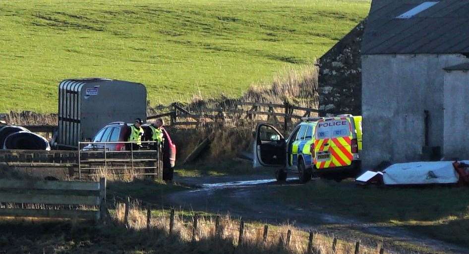 Officers appeared to be searching the area around the farm. Picture: DGS