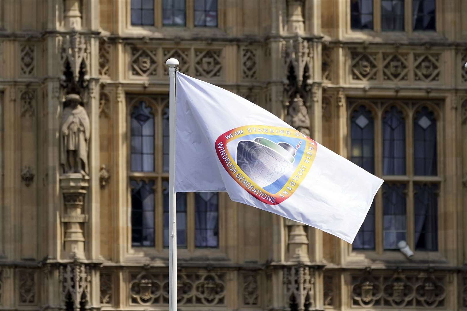 The Windrush flag flies at the Houses of Parliament (Aaron Chown/PA)