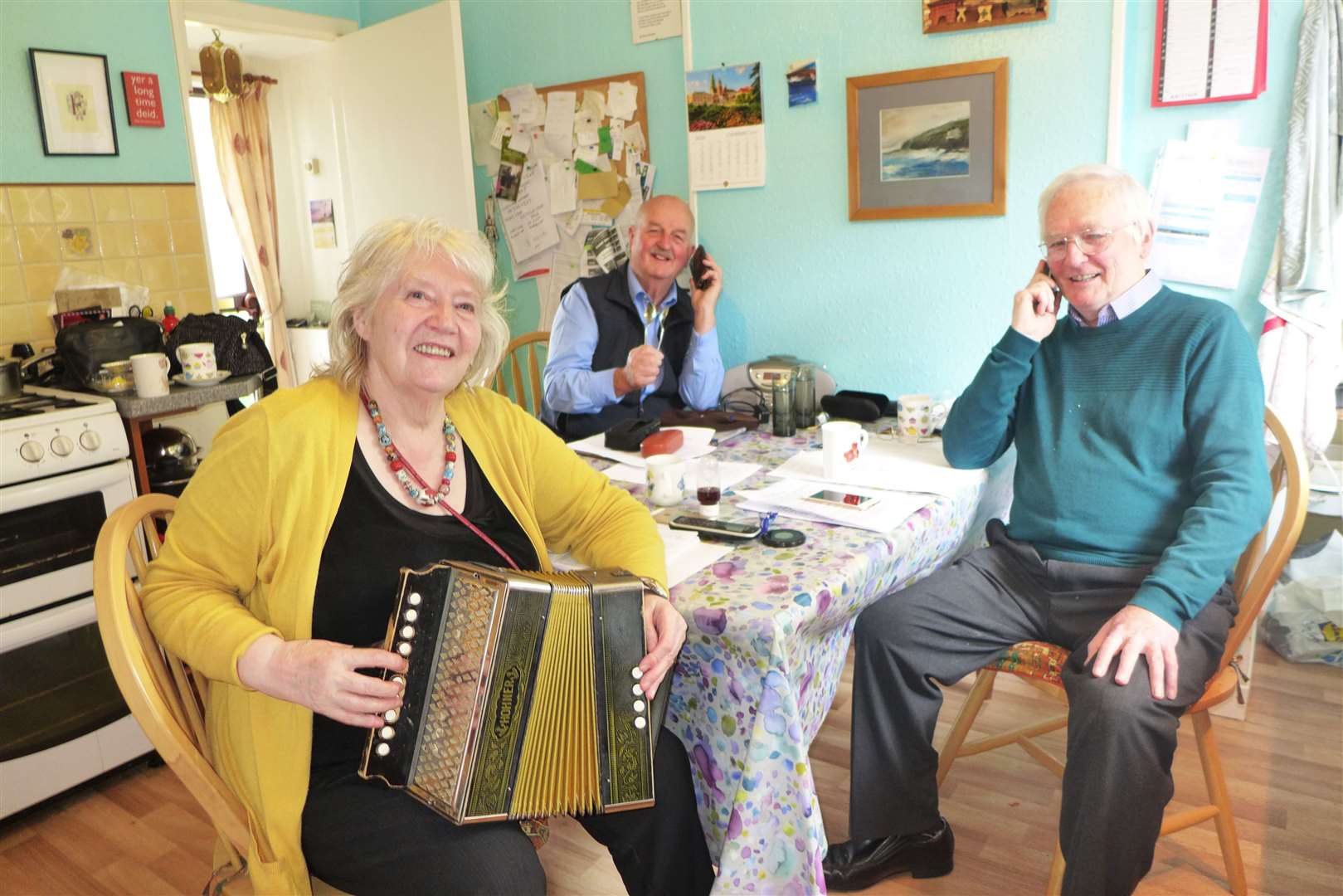 Nancy Nicolson and Eric Farquhar with Willie Mackay looking on at the kitchen ceilidh.