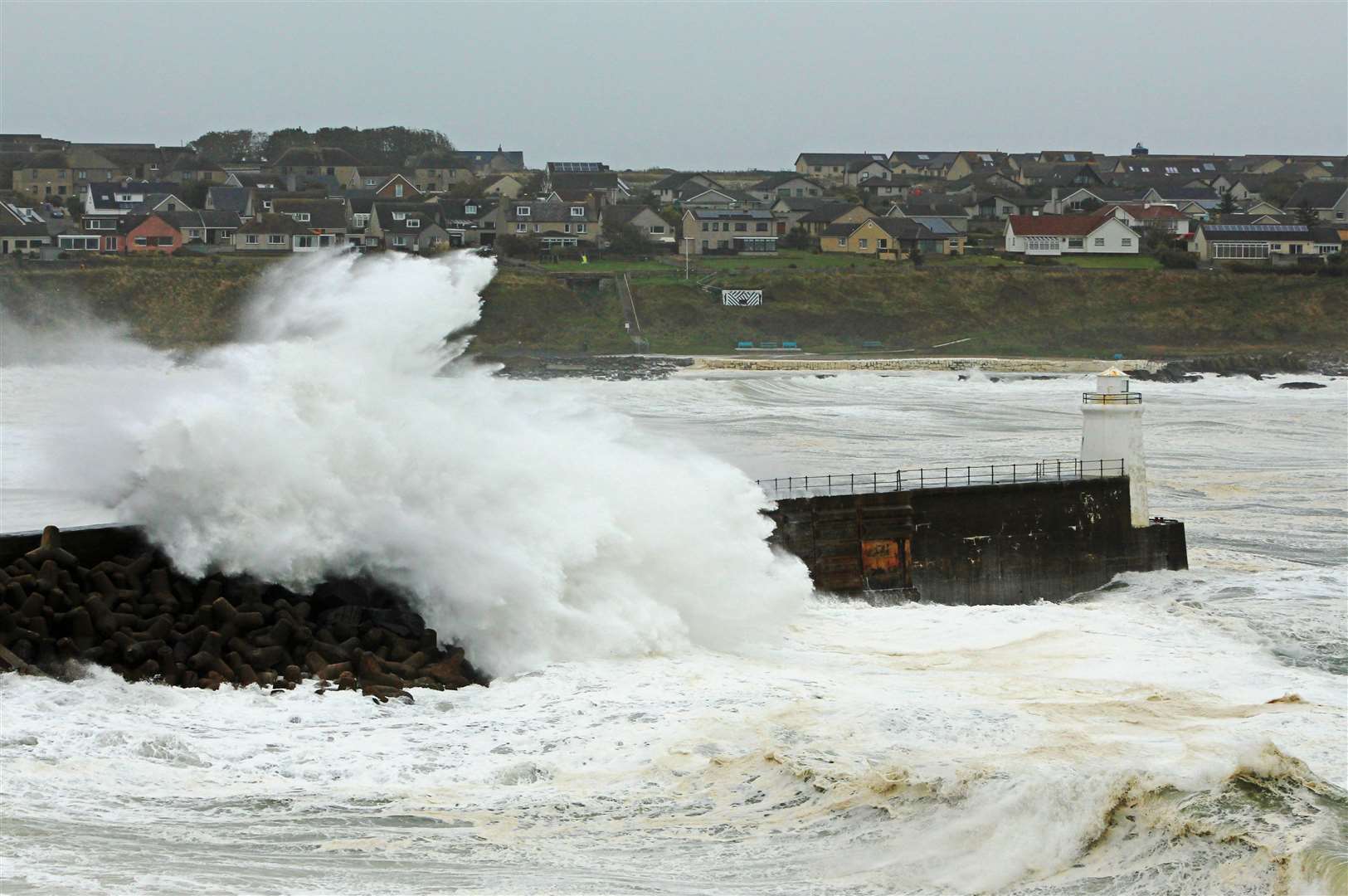 Wick took a battering during Storm Babet in October, and high tides and powerful waves continued to hit the harbour in the following weeks. Picture: Alan Hendry