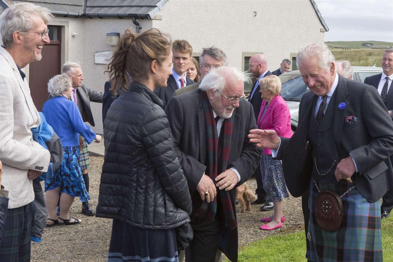 Before leaving Canisbay Church Hall, Prince Charles shares a joke with writer and director Murray Watts and artist and John O'Groat Journal columnist Monique Sliedrecht. Picture: Robert MacDonald/Northern Studios