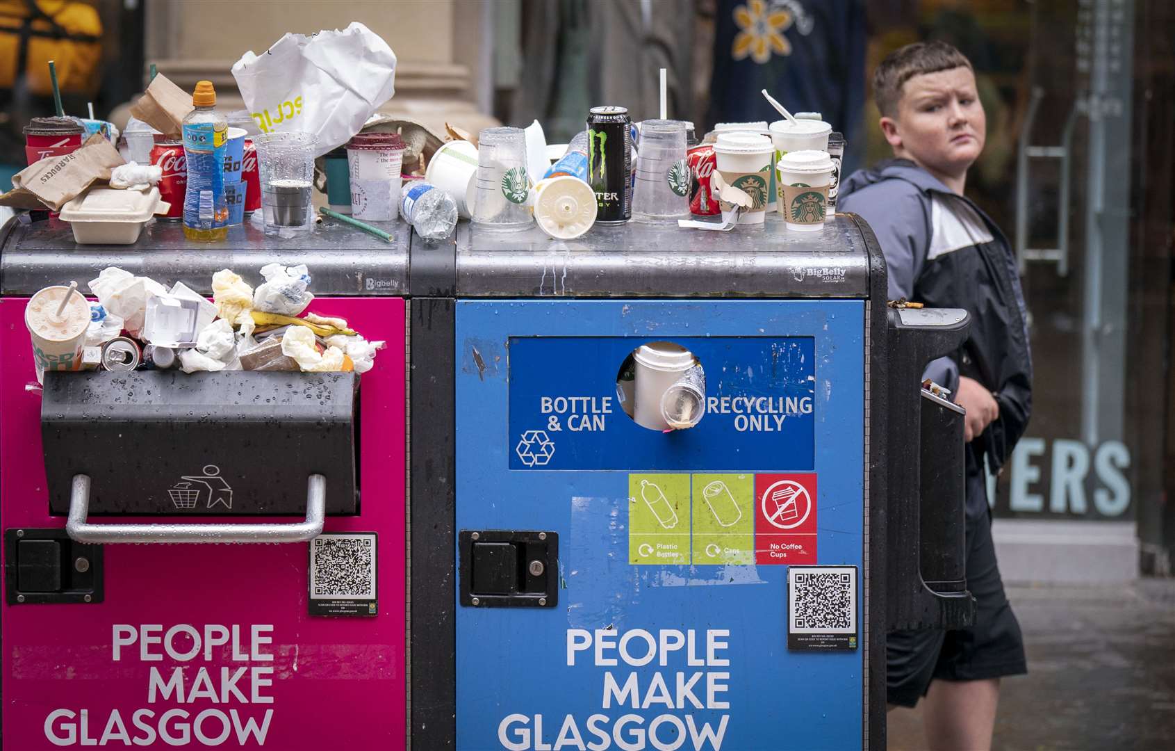 Bins in Glasgow are overflowing after the strike by council waste workers spread (PA)