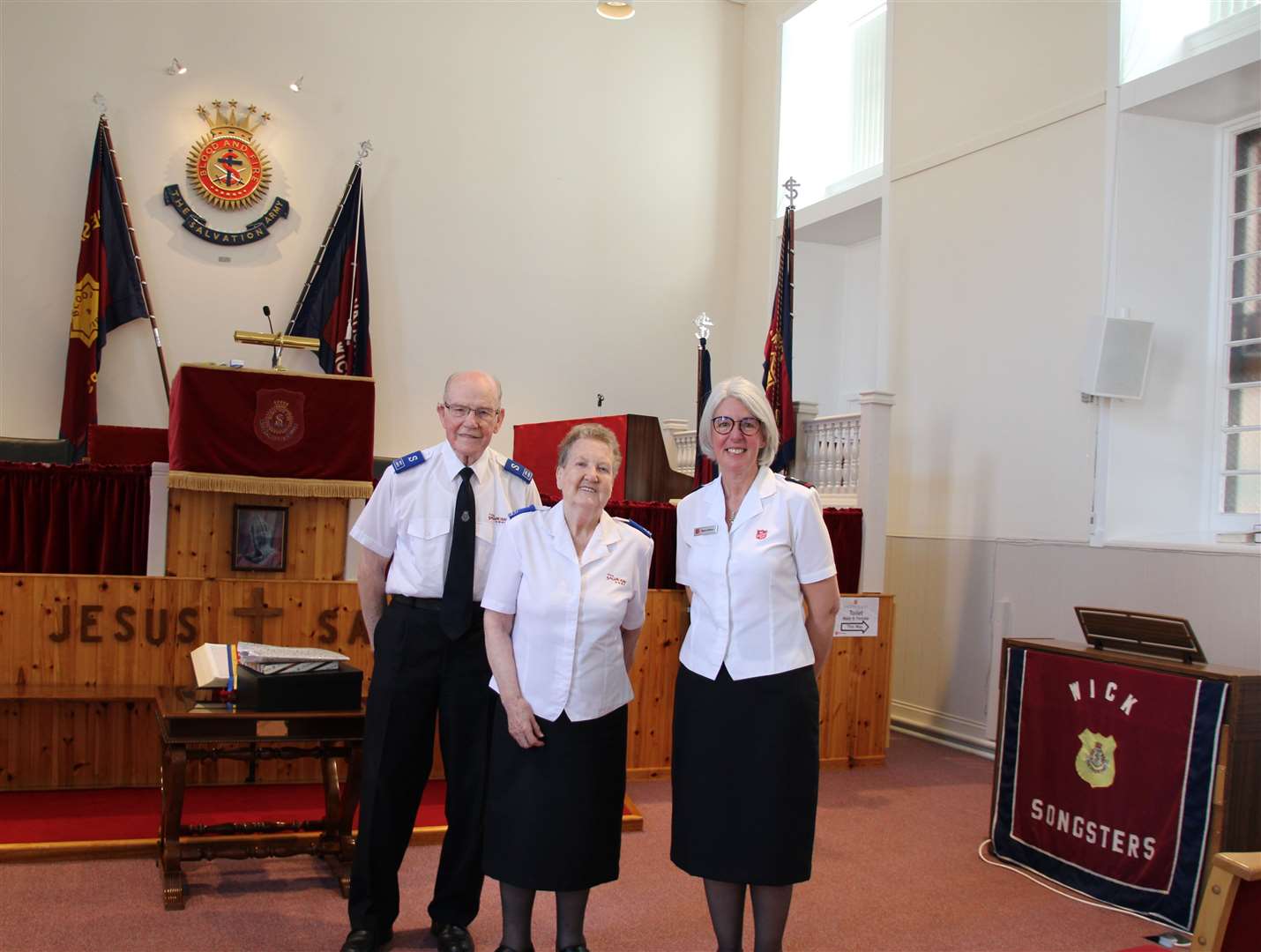 Mary Glass (centre) with her husband Jack and Cadet Diane Johnson at the Salvation Army hall in Wick. Mrs Glass was presented with flowers and a vase on the occasion of her retirement.