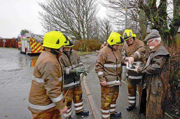 Residents in Watten showed their appreciation to fire crews tackling flooding in the village. Photo: Maria Paterson.