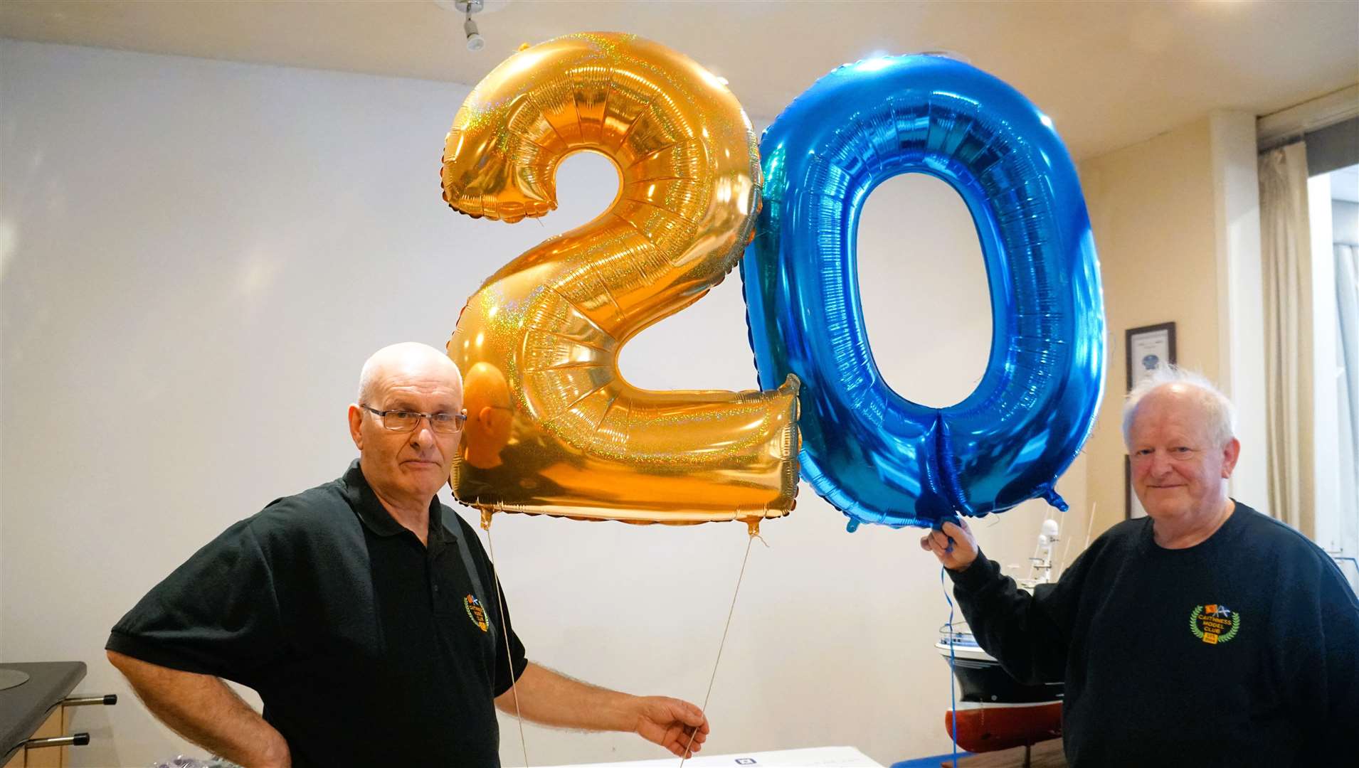 Kenny Gunn (left) is Caithness Model Club chairman and beside him is the event organiser and club secretary Davie Mackenzie. As can be seen in the picture, the club was celebrating its 20th year at the event in Wick. Picture: DGS