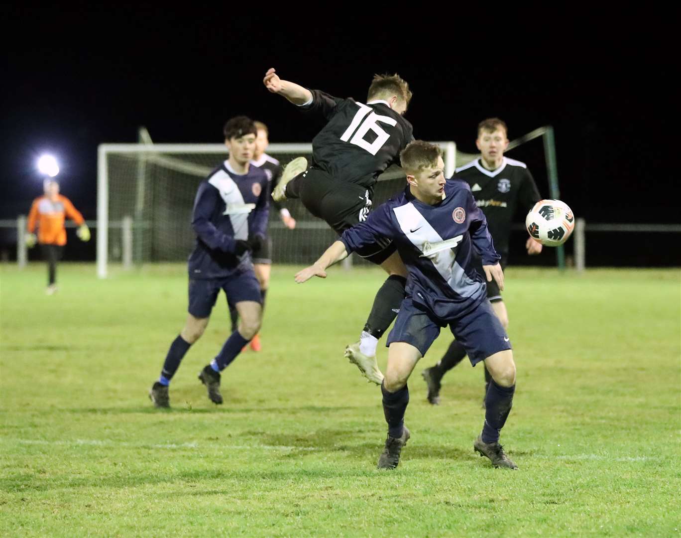 Thurso's Cameron Montgomery takes to the air in this clash with Korbyn Cameron of Halkirk United. Picture: James Gunn