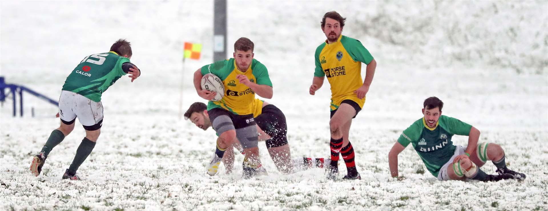 Stuart Kirk makes a break for the Exiles/Students at snow-covered Millbank. Picture: James Gunn