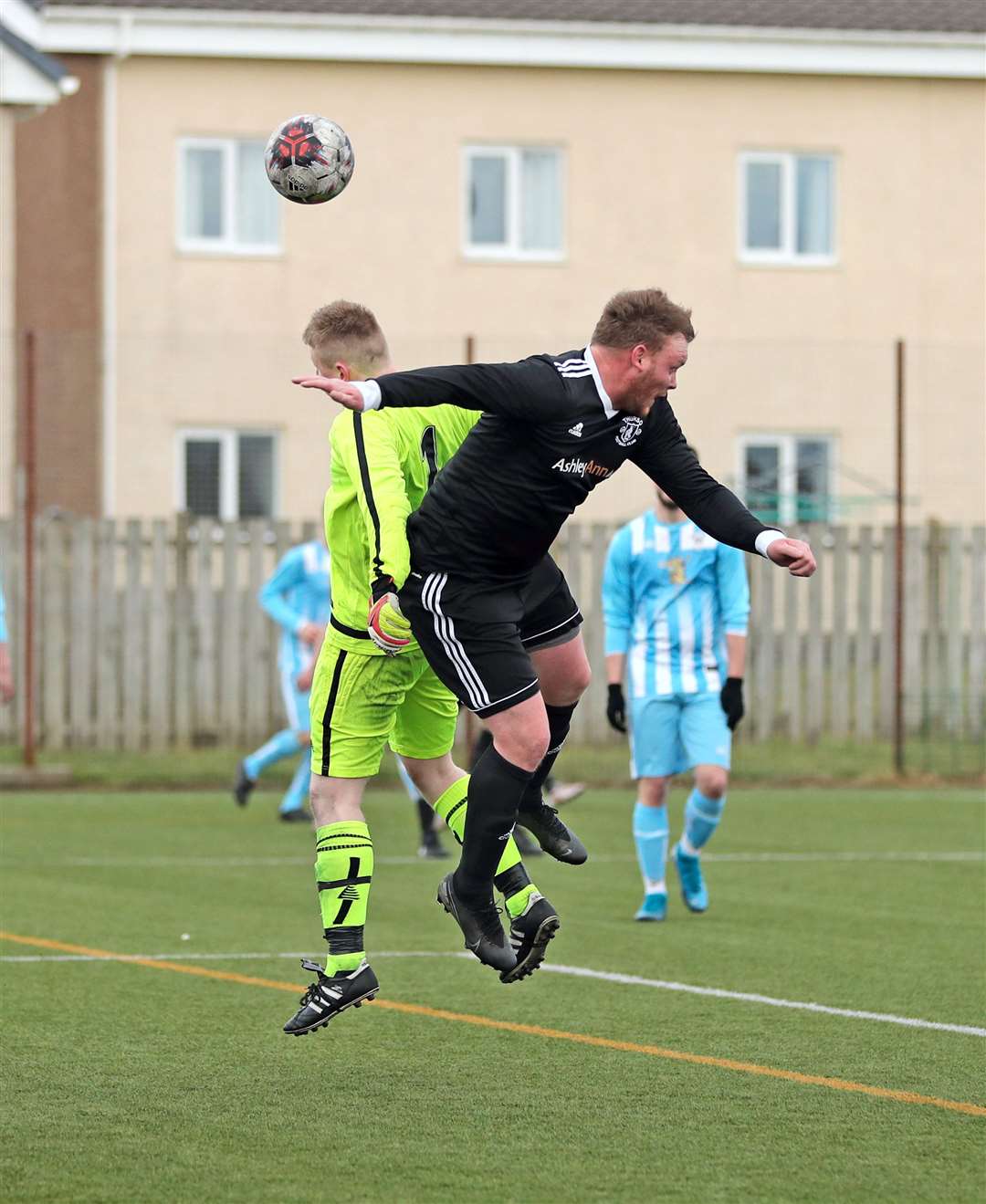 James Murray of Thurso jumps with Bunillidh goalkeeper Cameron Yuill. Picture: James Gunn