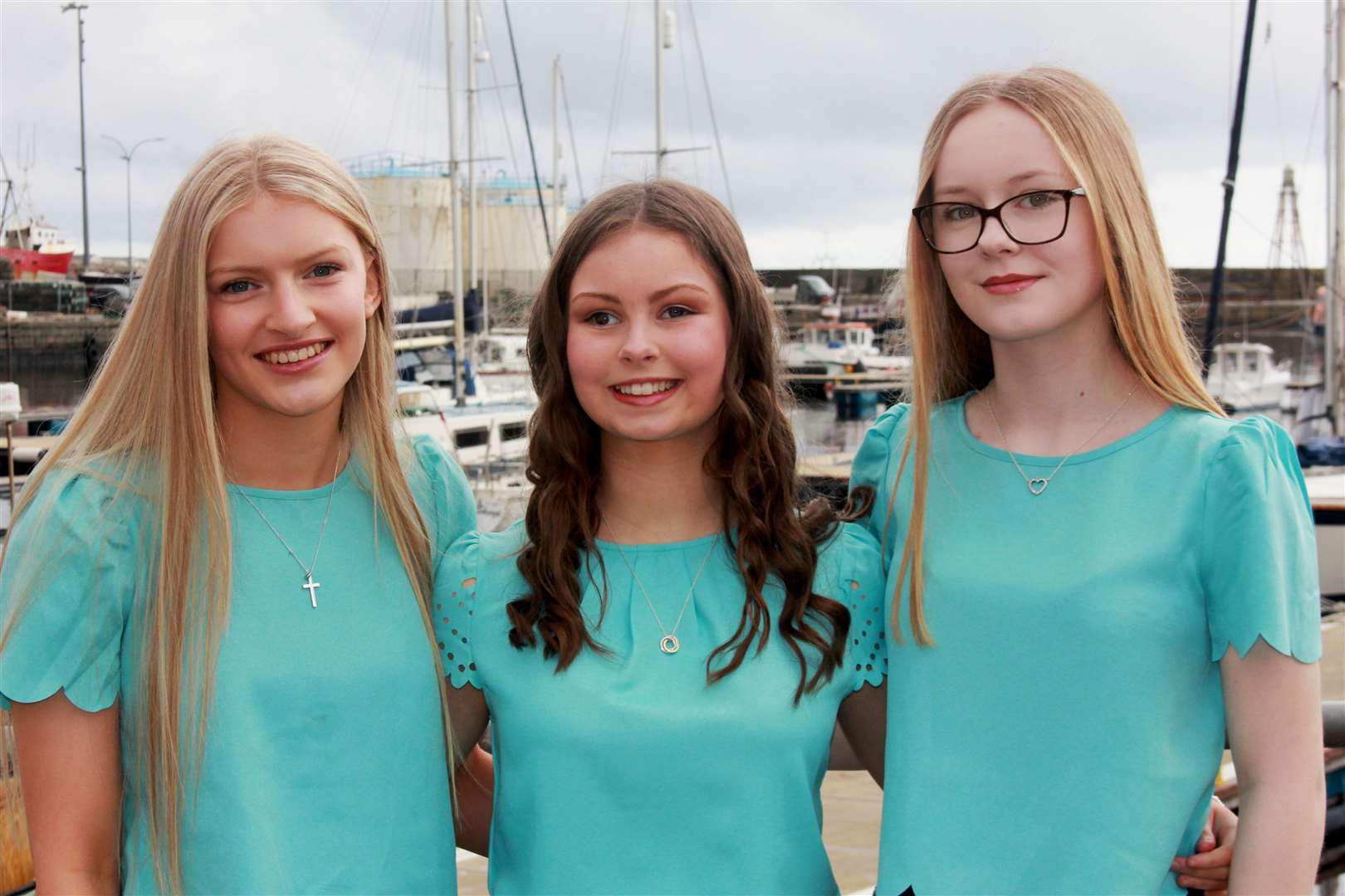 Wick’s gala queen for 2024 is Anna Durrand (centre), pictured at the harbour with her attendants Lena Forbes (left) and Mia Gunn. Wick Gala Week takes place from July 27 to August 3. Picture: Eswyl Fell