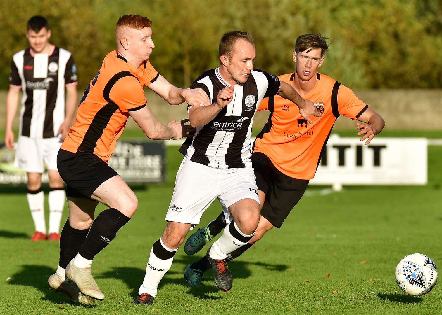 Wick Academy's Richard Macadie drives past Rothes' Aiden Wilson and Allen Mackenzie. The Scorries head to Nairn this weekend – their fifth away match in a row. Picture: Mel Roger