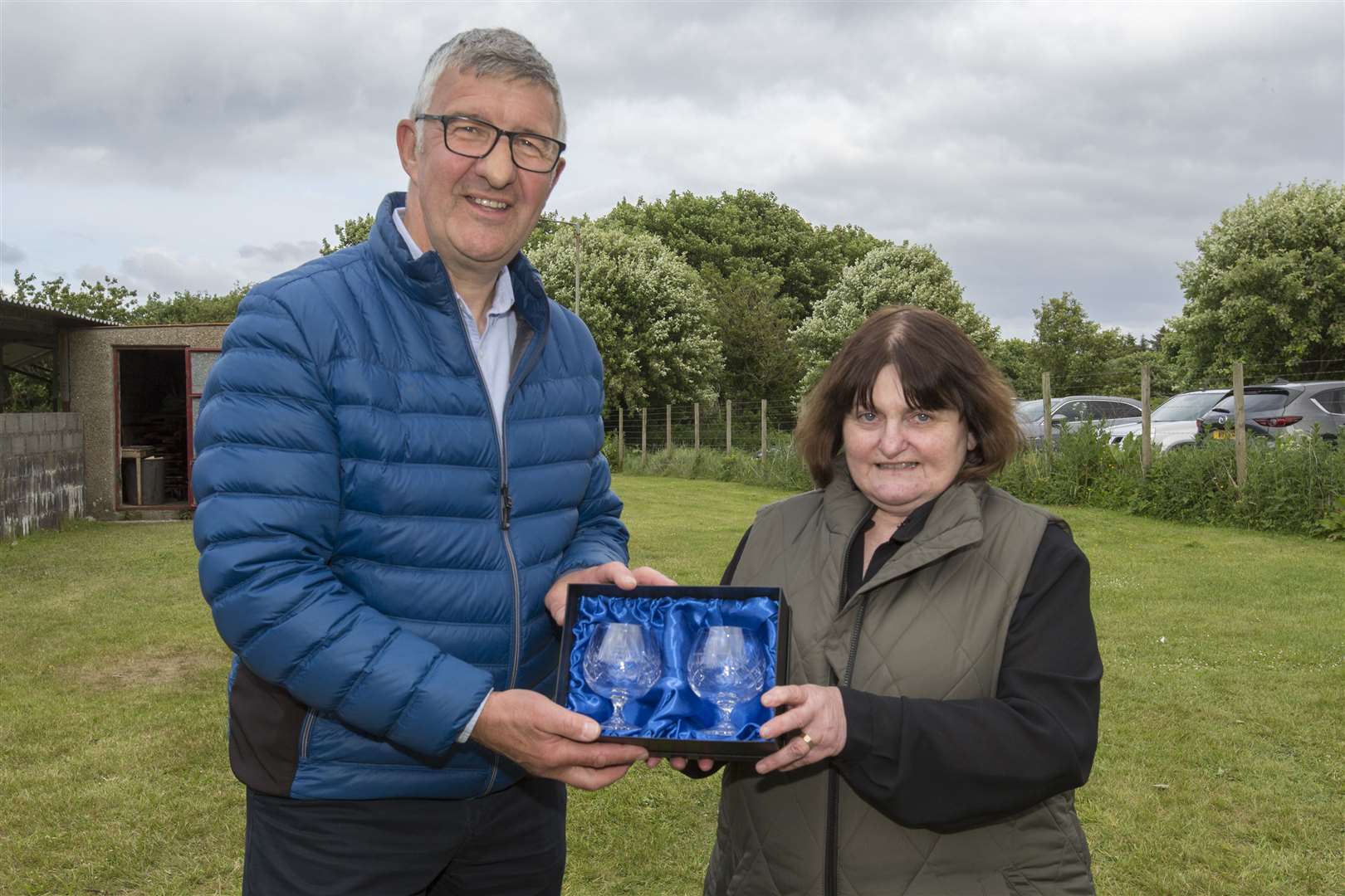 To mark her retirement as Caithness Small Bore Rifle Association's secretary, Marty Simpson was presented with a pair of engraved glasses by Willie Watt, Vice-Lieutenant of the county. Picture: Robert MacDonald / Northern Studios