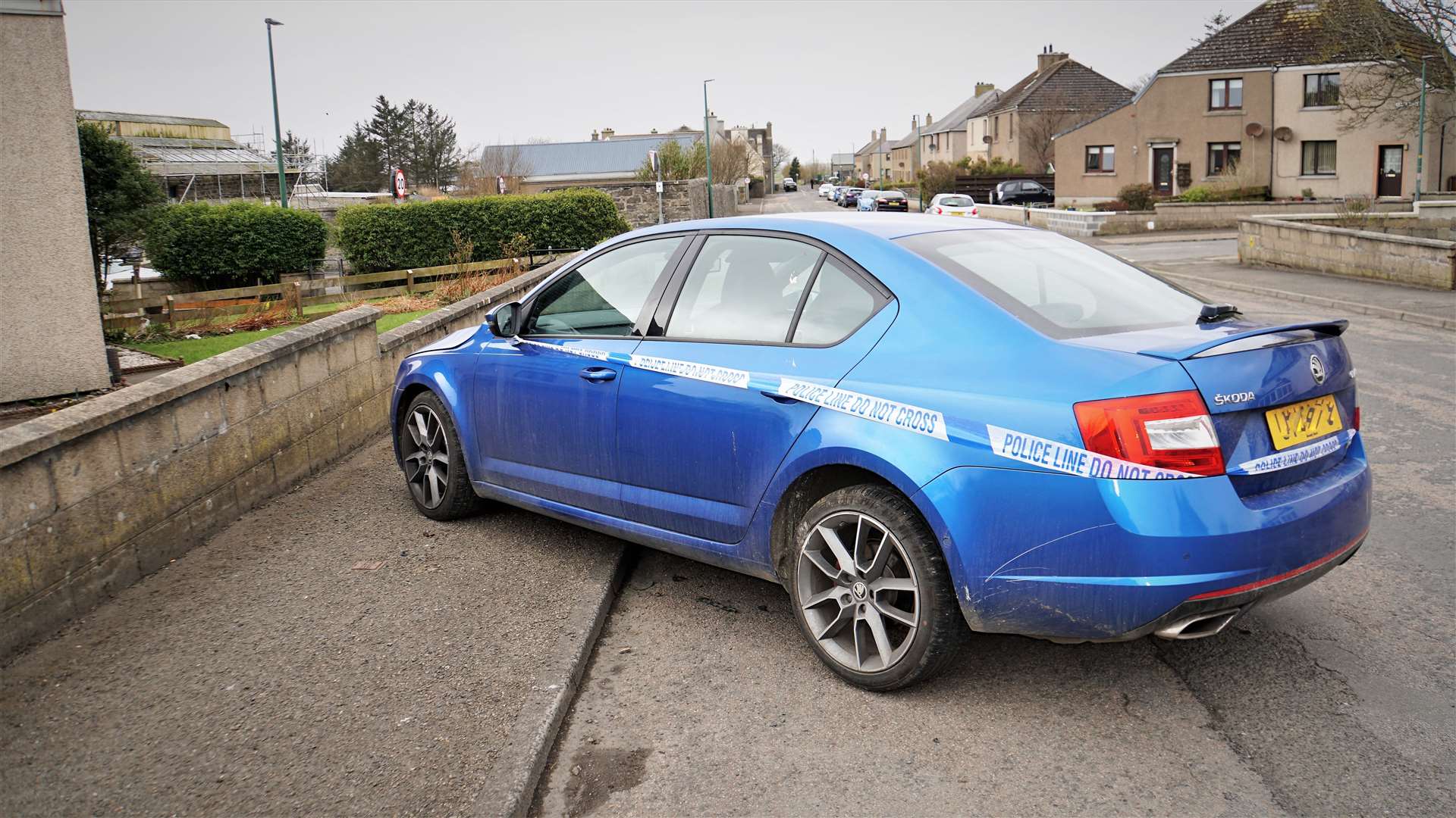 Police tape has been put around the Skoda Octavia showing it is part of a crime scene investigation. Picture: DGS