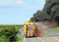 At 9.48am this morning the diesel tank of the recycling truck explodes and thick black smoke bellows out. Photos: Willie Mackay.