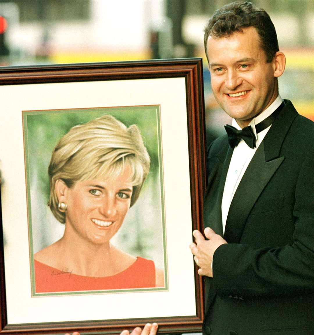 Paul Burrell holds a portrait of Diana, Princess of Wales (PA)