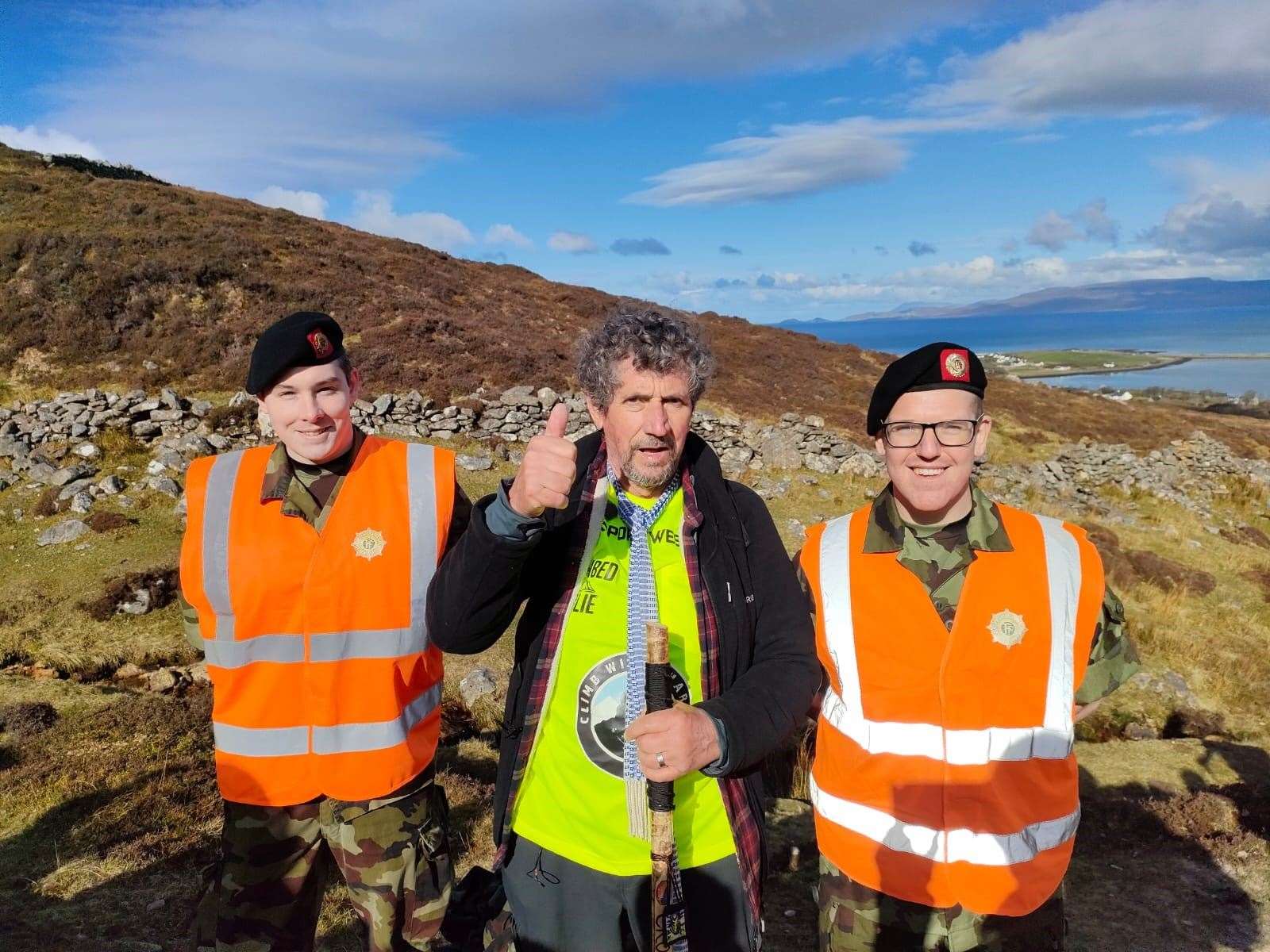 Charlie Bird with members of the Defence Forces during his hike up Croagh Patrick in Co Mayo in 2022 (Paul Allen and Associates/PA)