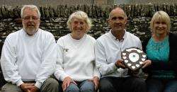 Winning trio, Marshall Bowman (left), Eileen Perry and John Grant, pictured with Linda McDonald, daughter of Willie McDonald, who handed over the shield.