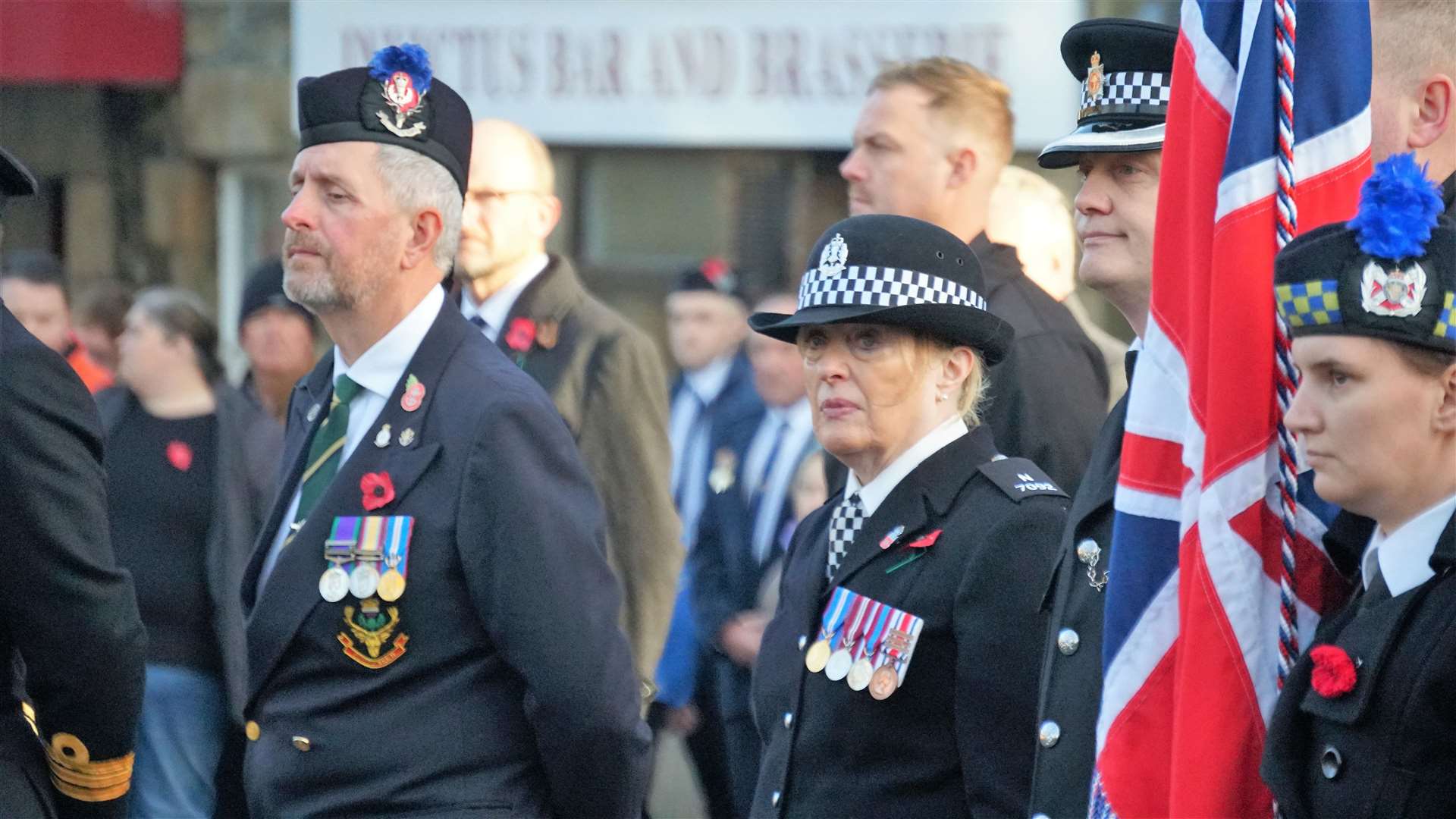 Special constable Thelma Mackenzie prepares to lay a wreath at the Remembrance Sunday event in Thurso. Picture: DGS