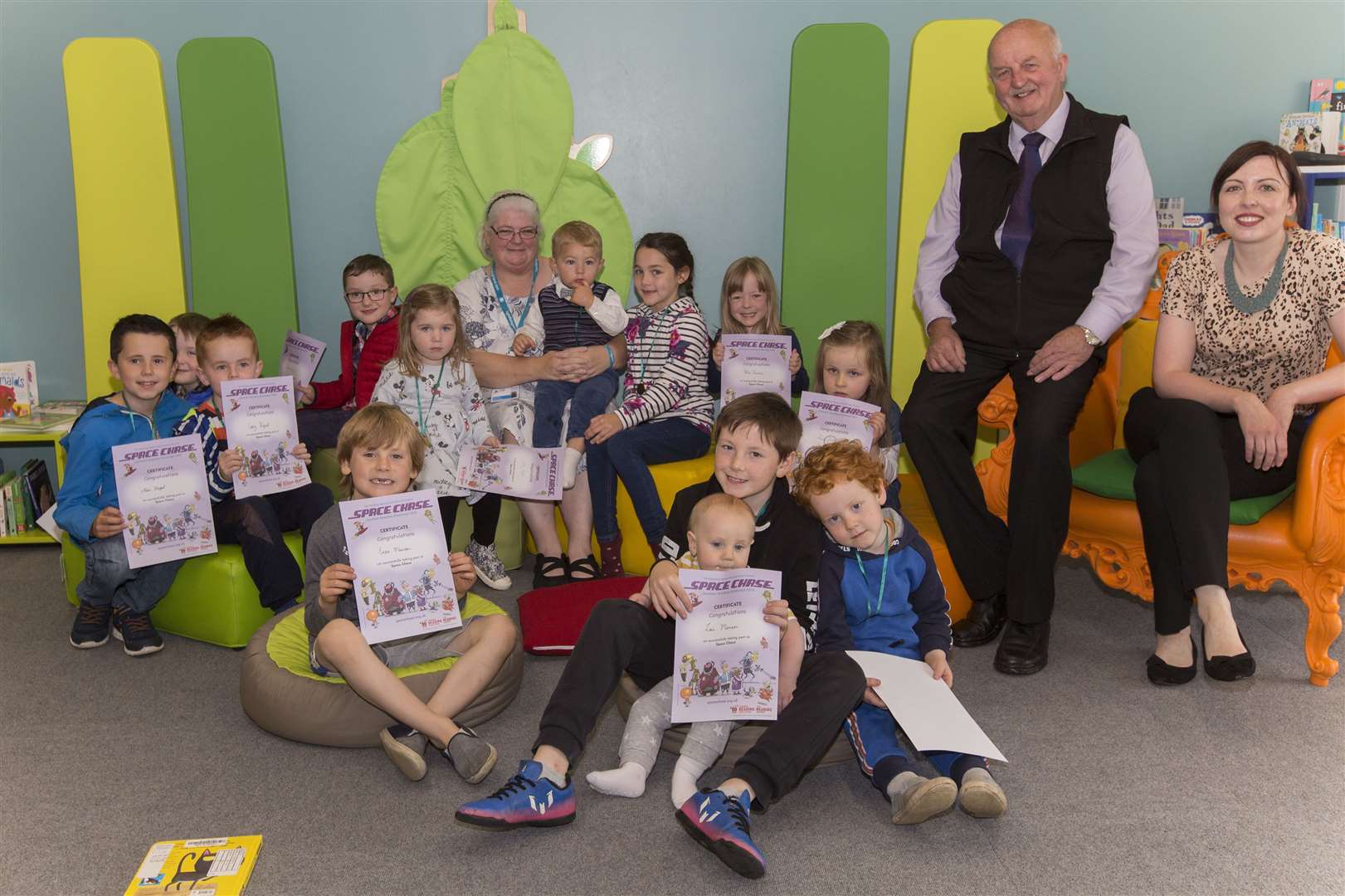 Summer reading challenge winners with librarian Ruan Peat (centre) and councillors Nicola Sinclair and Willie Mackay. Picture: Robert MacDonald / Northern Studios
