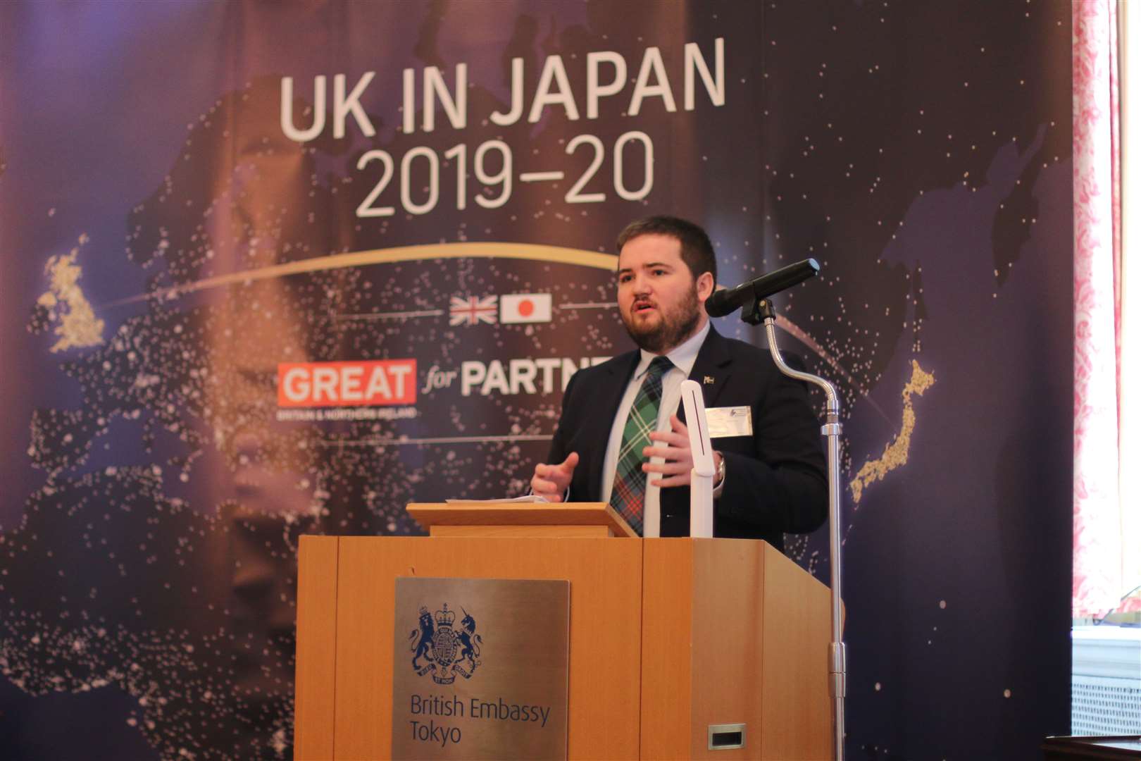 Councillor Struan Mackie delivering a speech on decommissioning and the community at the British embassy in Tokyo.