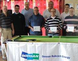 The winning team in the recent Doosan Babcock Open Scramble are pictured with their prizes – (from left) Grant Maxwell, Willie Allan and Leslie Malcolm – while some of the other competitors look on.