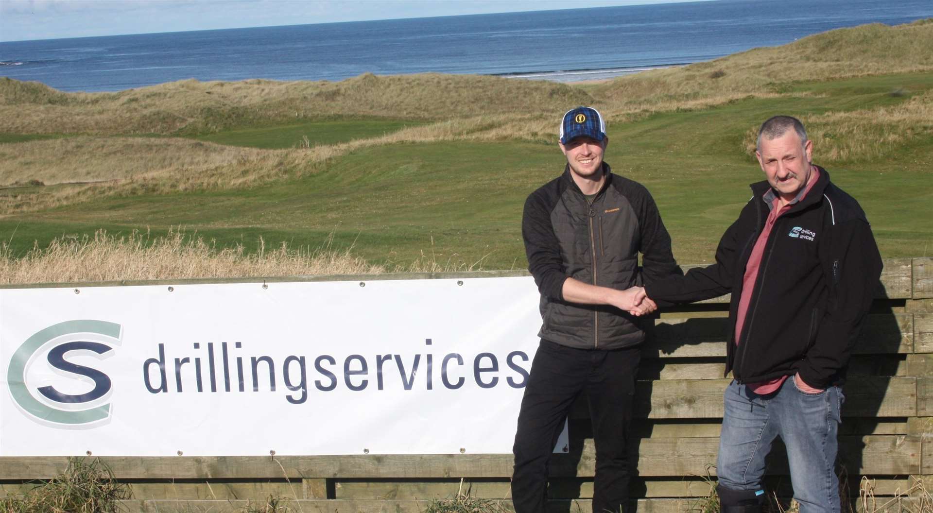 Charlie Smith (right) of CS Drilling congratulating winner Lee Malcolm following the recent CS Drilling Open at Reay.