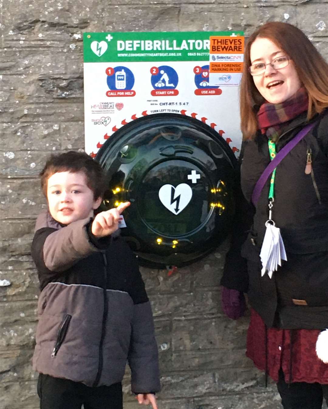 Mother and son Hazel and Iain Dunbar beside one of the Castletown defibrillators.