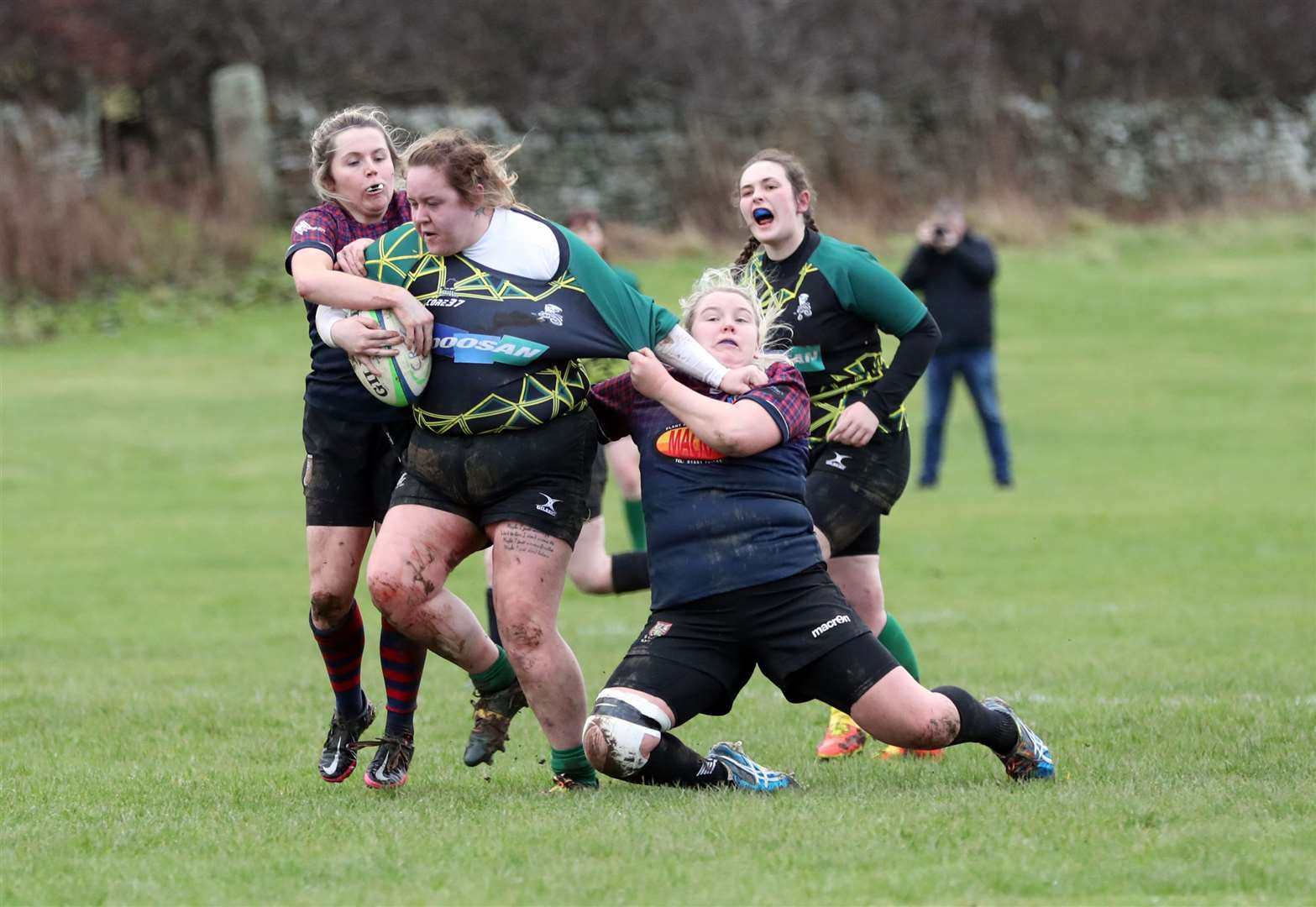 Shauna Malcolm is hauled down only five metres from the try line. Picture: James Gunn