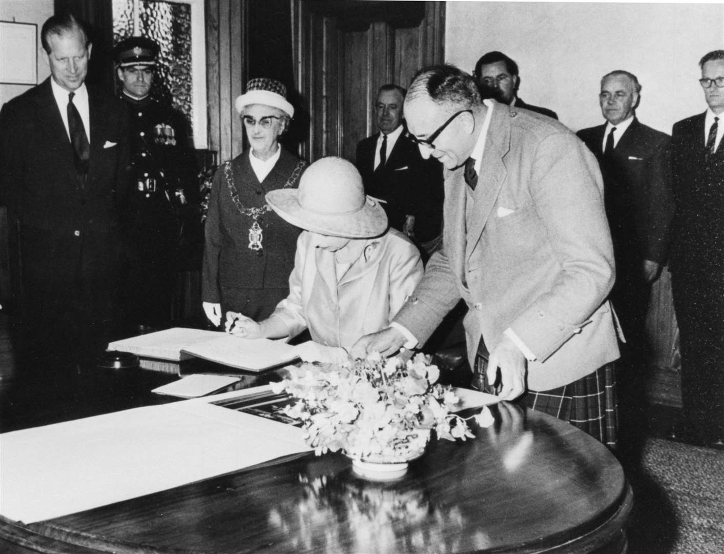 The Queen signing the visitors' book at Thurso Town Hall in June 1964. Picture courtesy of Alan McIvor