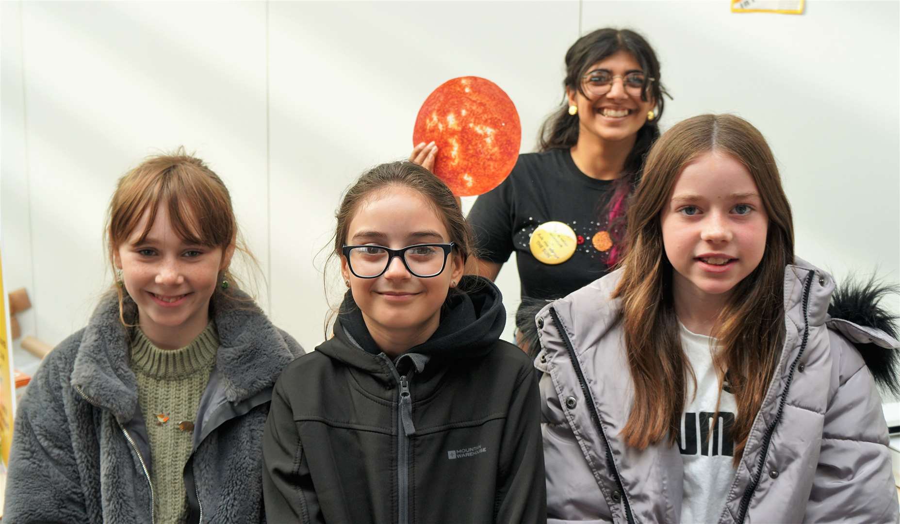 Emmie, Amy, Ellie at front with Tish Mehta who was talking to the girls about helioseismology (earthquakes on the sun). Picture: DGS