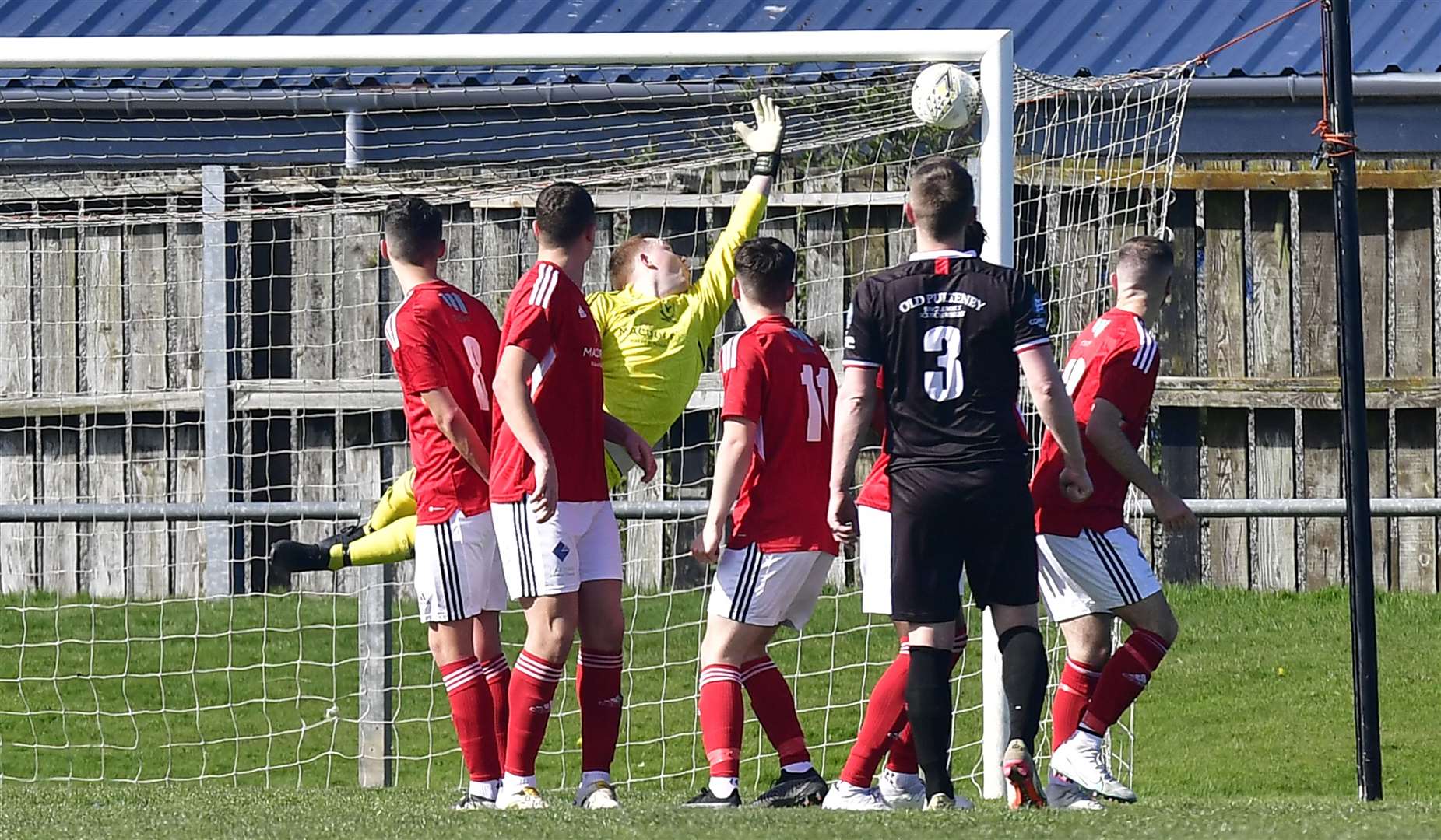 Gary Manson (number 3) watches as his free kick flies past Deveronvale keeper Sean McIntosh to give Wick Academy a 2-1 lead. Picture: Mel Roger