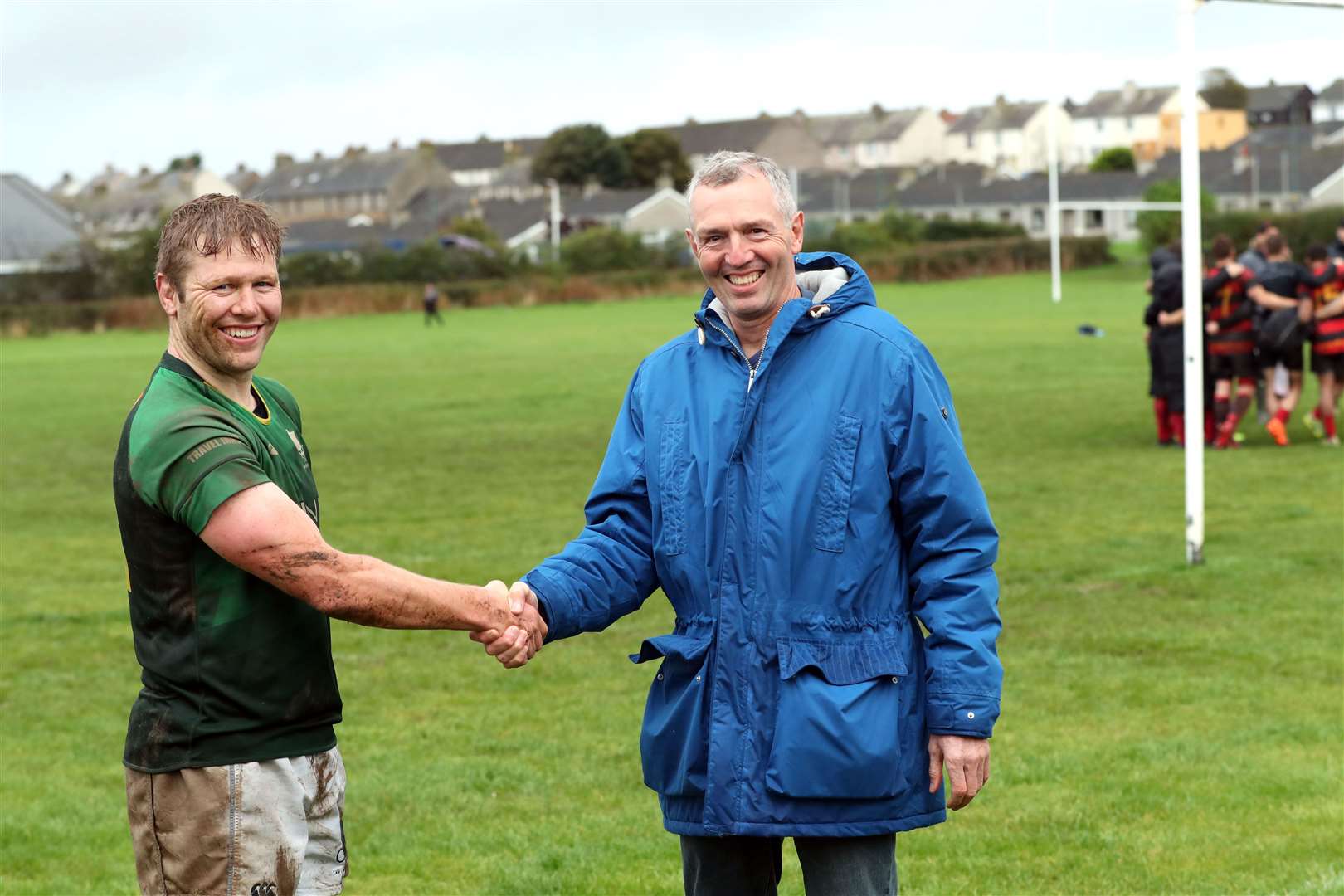 David Sutherland congratulates his son Evan on breaking his record for the most number of tries for Caithness. Picture: James Gunn