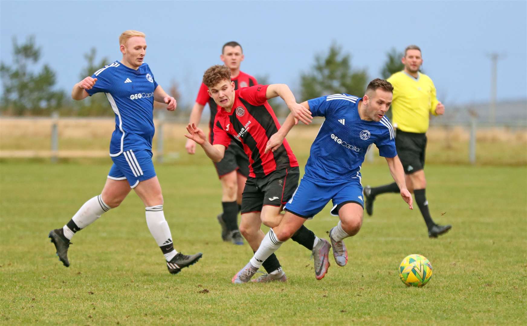Halkirk United's Mark Munro battles for possession during the 0-0 draw with Invergordon at Morrison Park. Picture: James Gunn