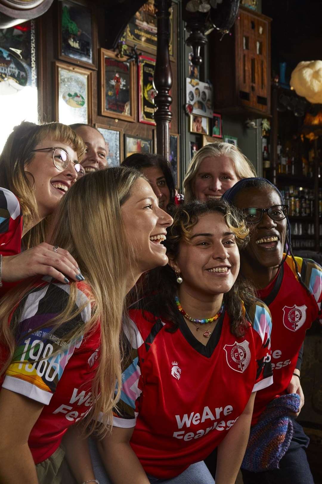 Members of Hackney Women’s Football Club wearing their new kit. Megan Kapadia is pictured in the centre of the front row (WeAreFearless/@DannyCheetham/The Queen Adelaide/PA)