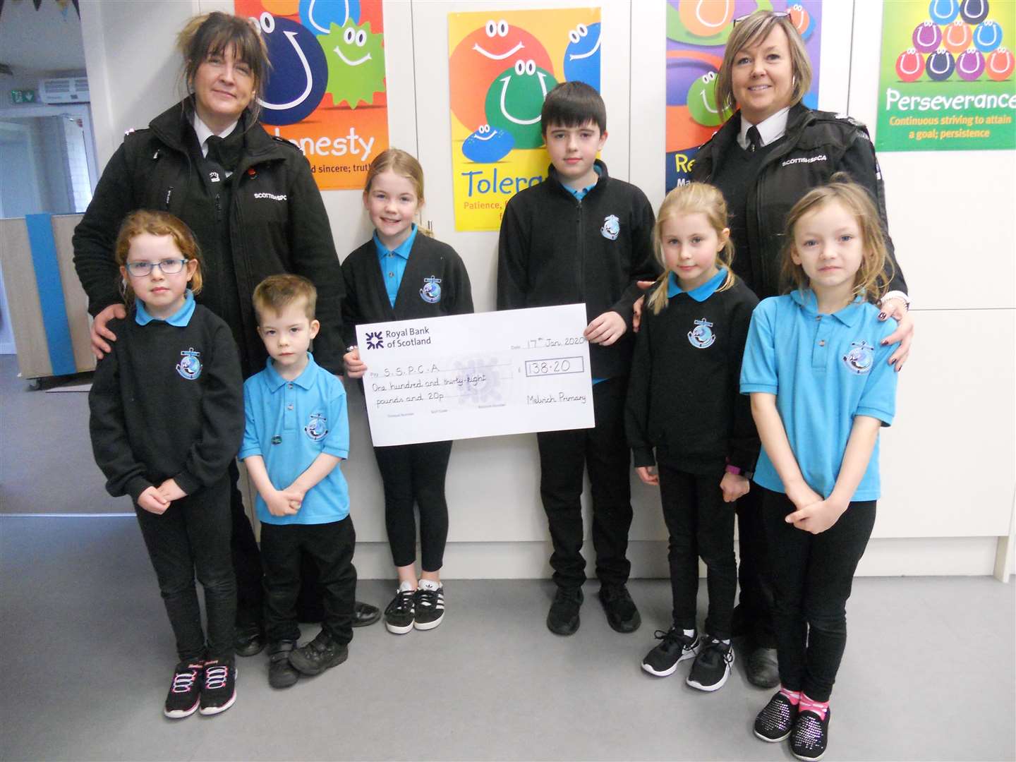 With the cheque are SSPCA representatives Christine Lord (left) and Maria Bain with eco committee members (from left) Megan Murray, Samuel MacKintosh, Zara MacKintosh, Donald Farquhar, Merryn Murray and Scarlett Heddle.
