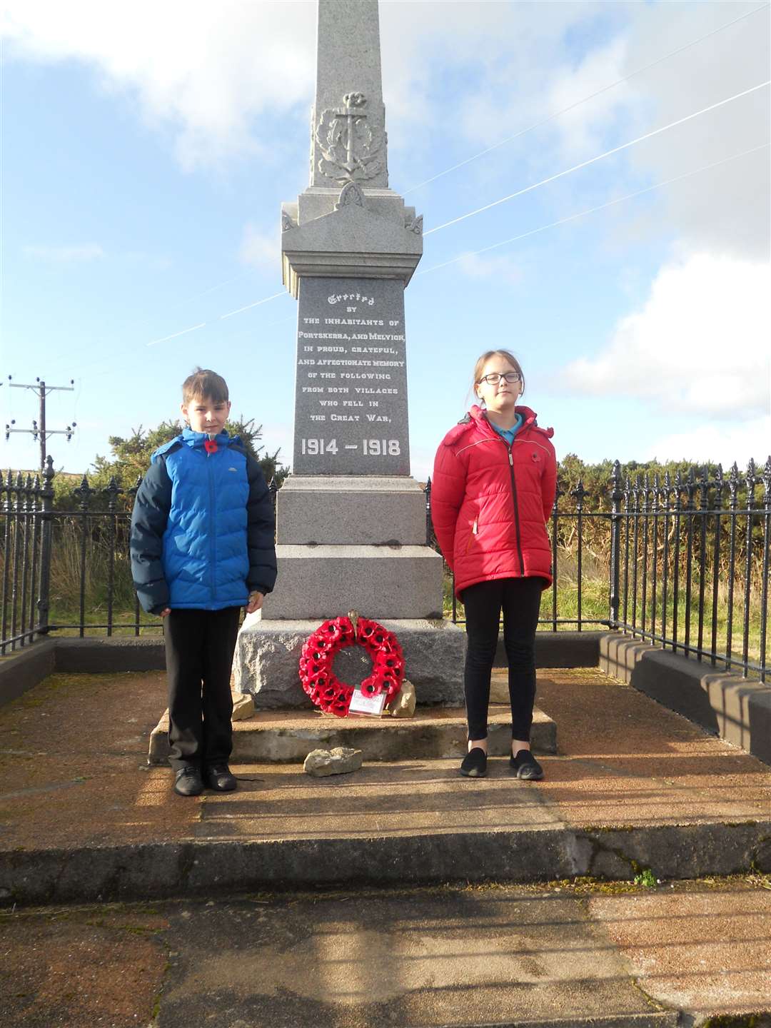 Melvich P7 pupils Dylan Mackay and Fifi Holroyd laying the wreath on behalf of the school.