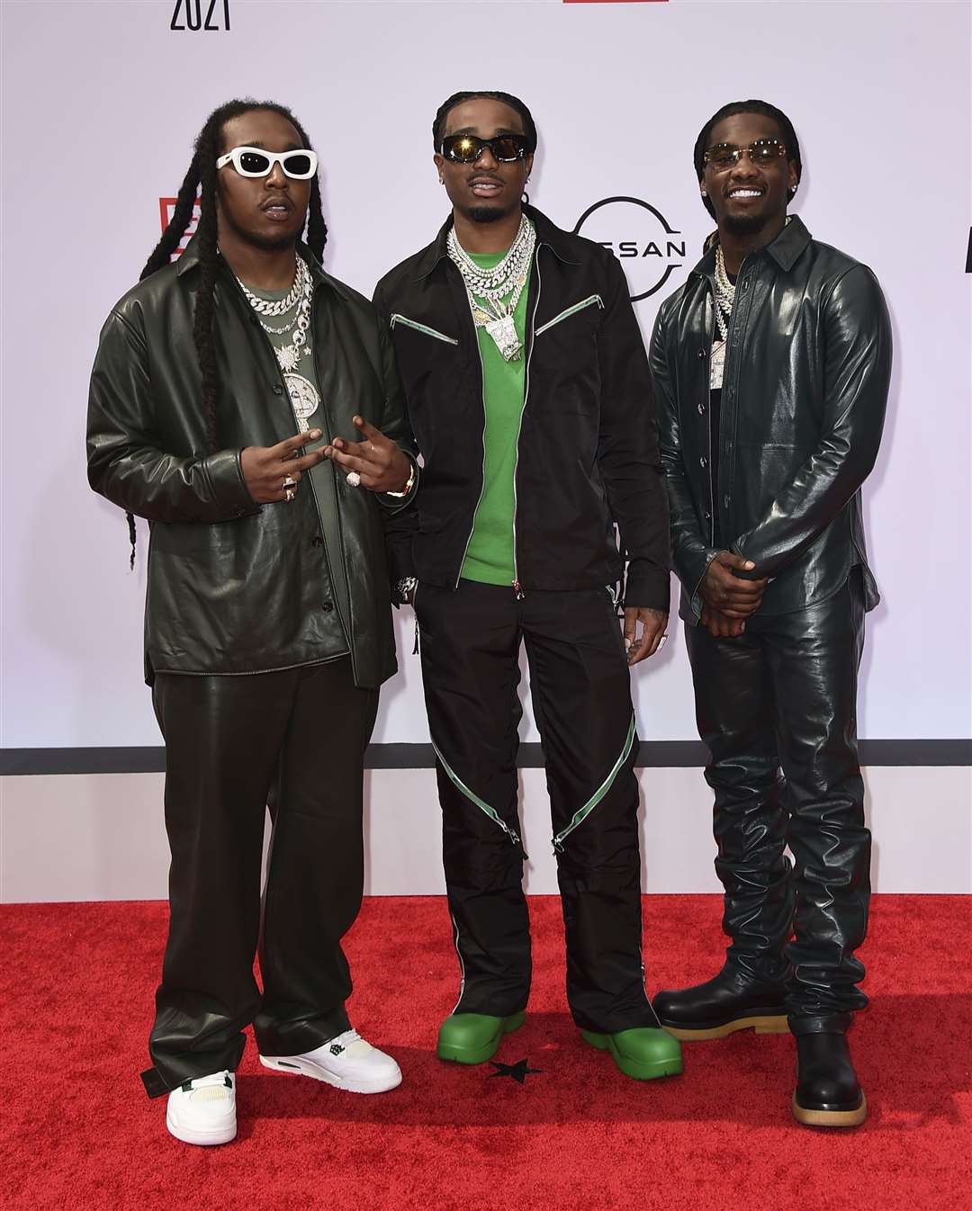 Takeoff (left) was part of the Atlanta-based group Migos alongside his uncle Quavo and cousin Offset (Jordan Strauss/Invision/AP File)
