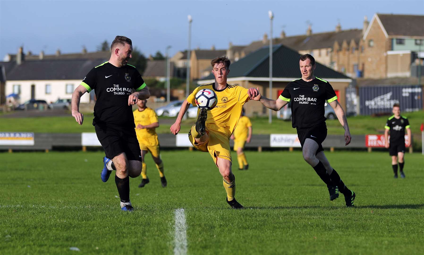 Staxigoe's Grant Aitkenhead appears to balance the ball on his toes as Ian Smith and John Maclean close in. Picture: James Gunn