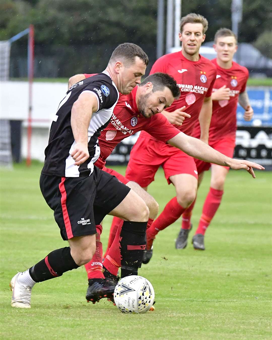 Wick Academy's Gordon MacNab takes on Neil MacDonald of Brora Rangers the last time the teams met in the North of Scotland Cup, at Dudgeon Park in August 2019. Picture: Mel Roger