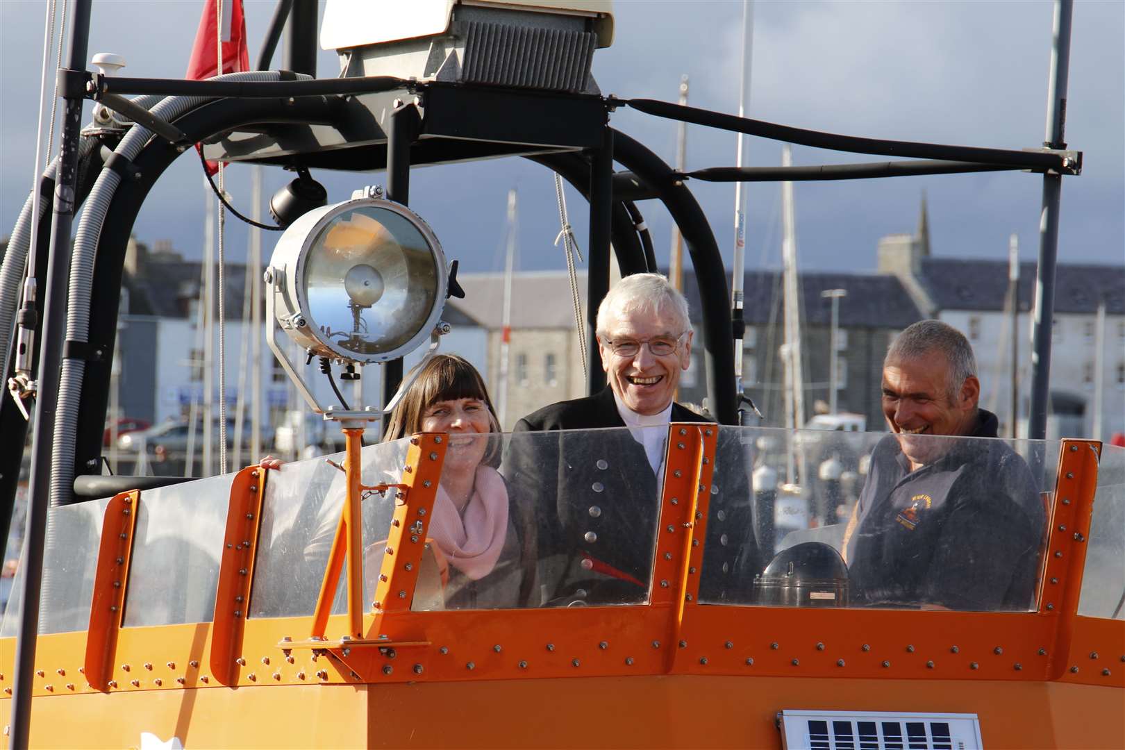 The Moderator and his wife Ruth on the bridge of the Roy Barker II at Wick along with second mechanic Graeme Campbell. Picture courtesy of RNLI