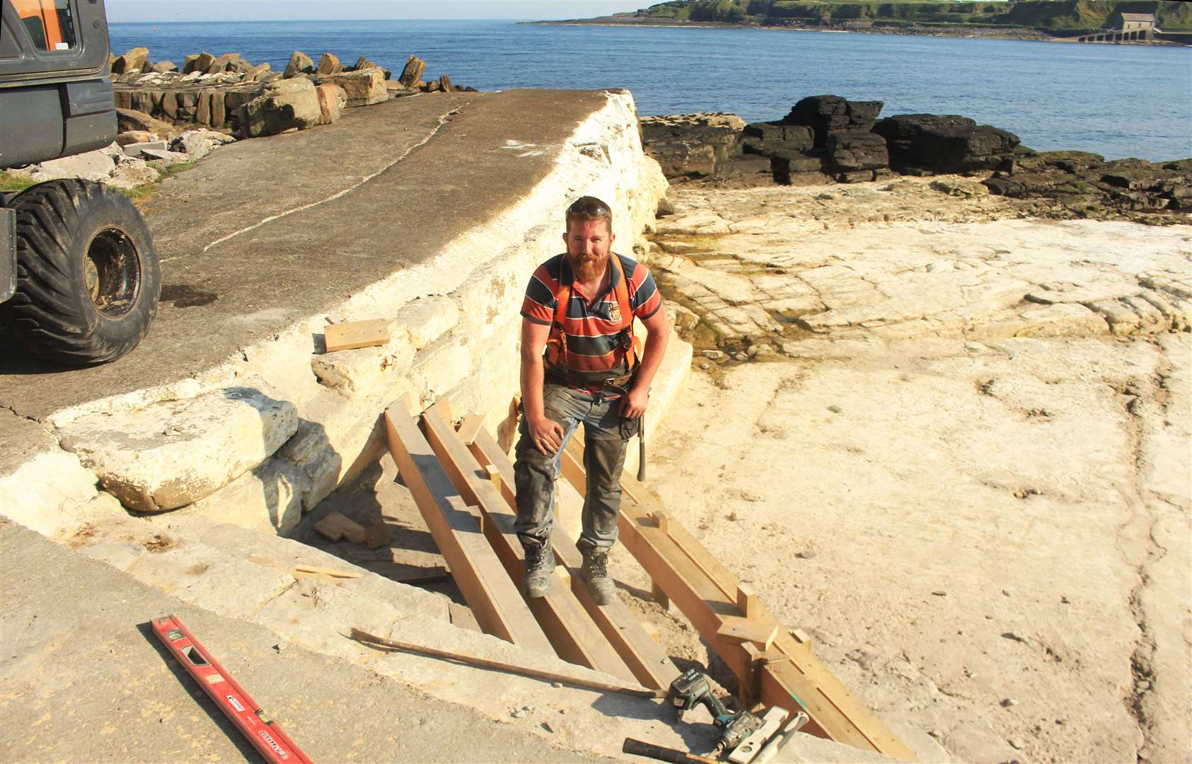 John Stewart of Wick-based JLS Formwork is repairing the steps at the shallow end of the North Baths.
