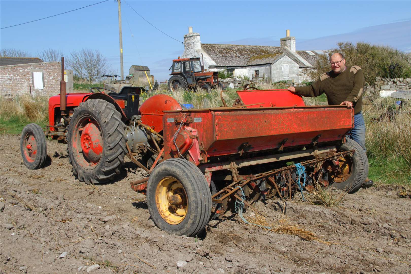 Thrumster crofter Peter Stewart, Burnthill, with his Massey Ferguson N7 – believed to be the oldest one of its kind still working in the county. Picture: Willie Mackay