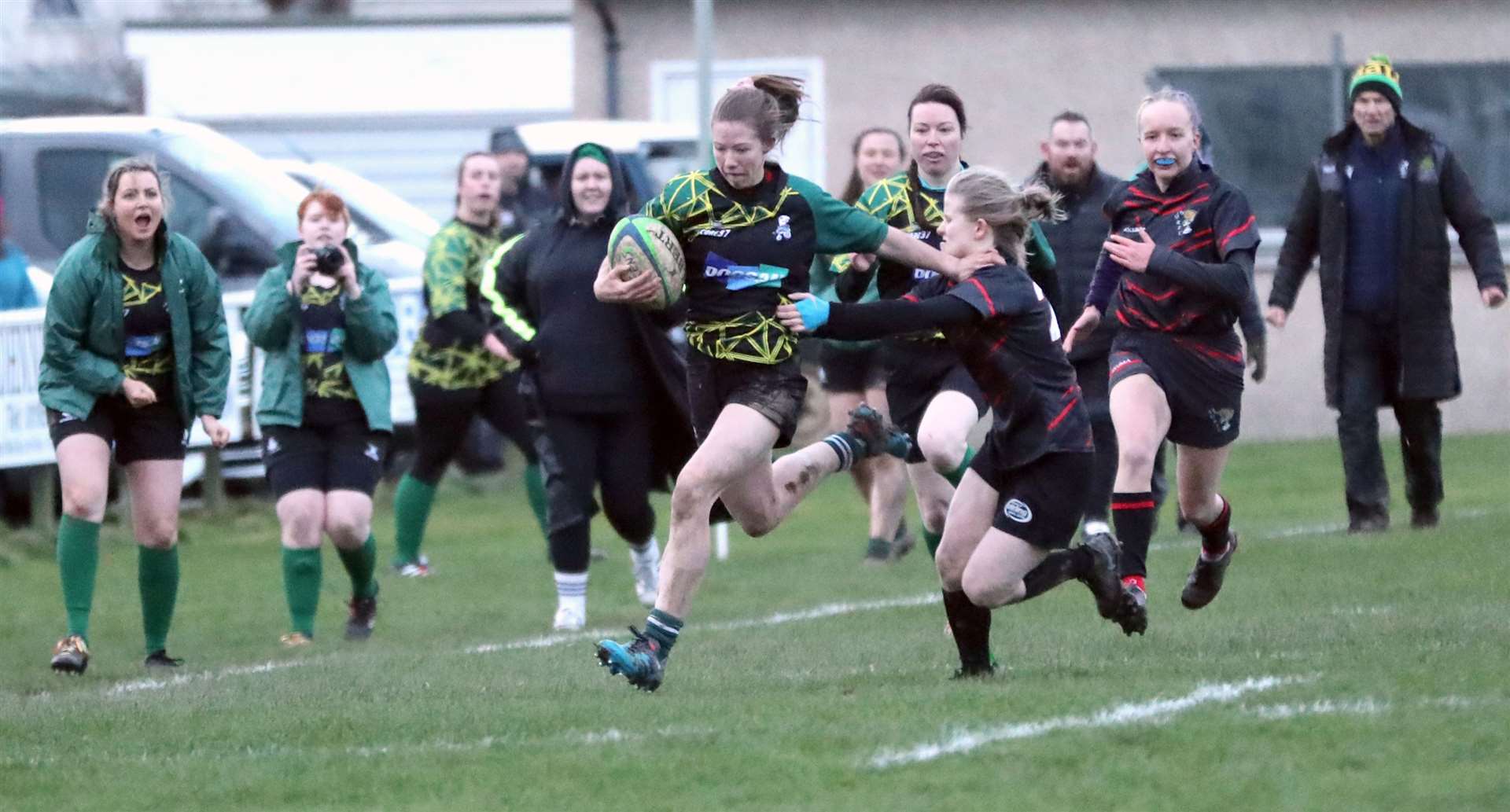 Caitlin Harvey fends off a tackle on her way to scoring a try during the Krakens' victory over Aberdeen Quines last month. Picture: James Gunn