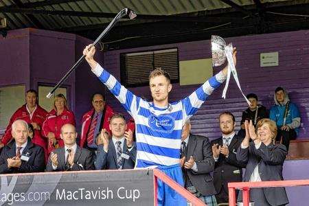 Newtonmore captain Andy Mackintosh lifts the Rose Bowl trophy.