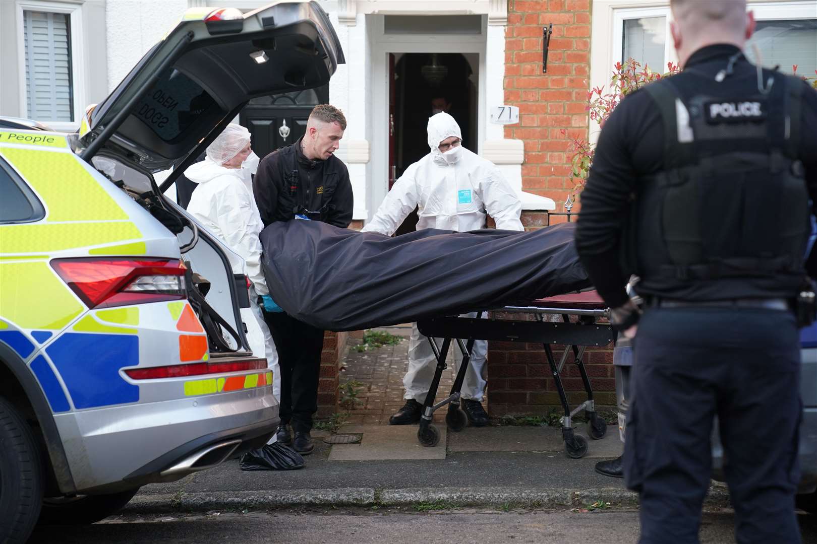 Forensics officers remove the body of Nicholas Billingham from his home (Jacob King/PA)