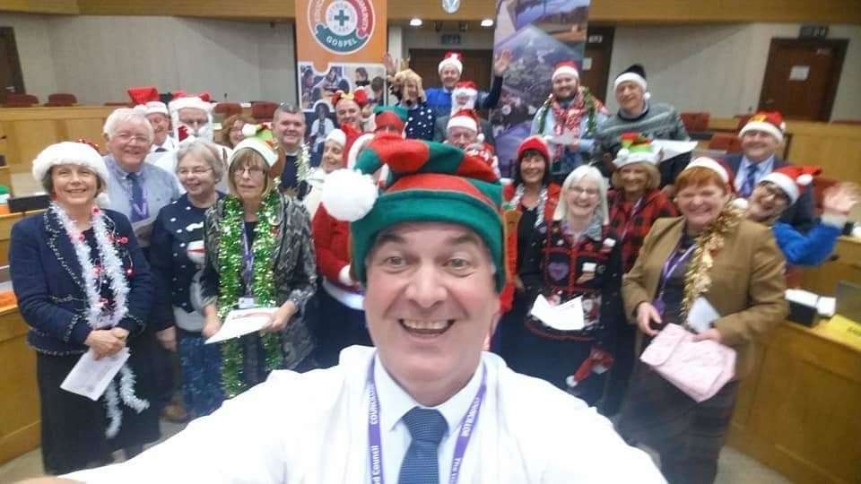 Councillor Raymond Bremner about to conduct the Highland councillors' choir in support of this year's Blythswood Christmas shoebox appeal.