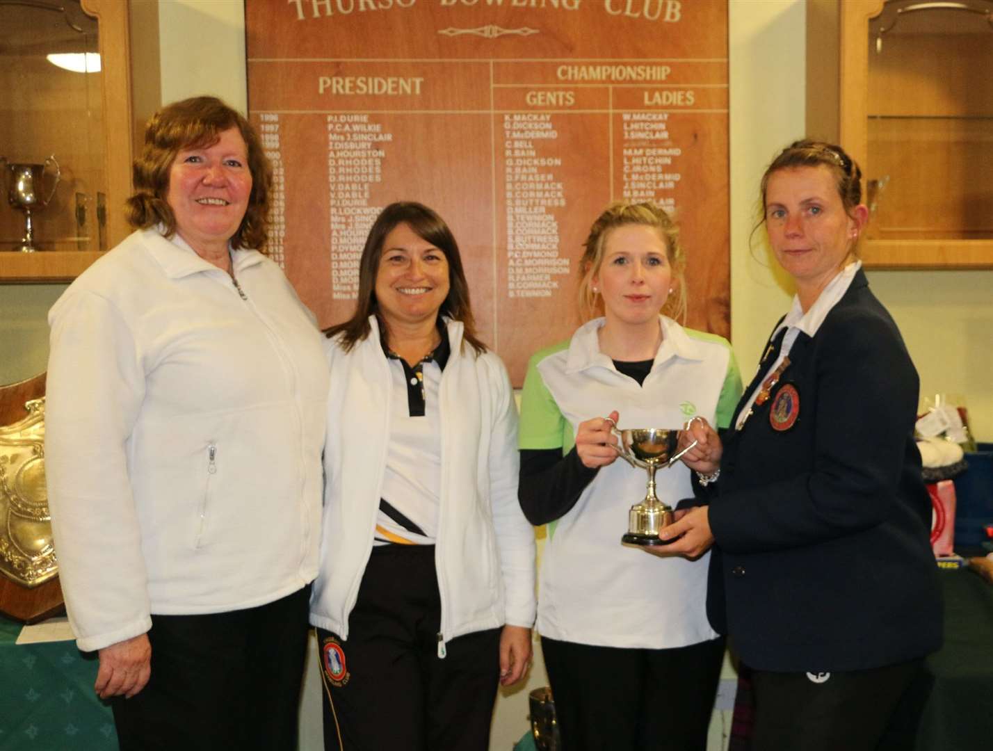 Ladies’ pairs runners-up Janet Sinclair and Julie Knapp with winners Lynne Swanson and Marina Bain.