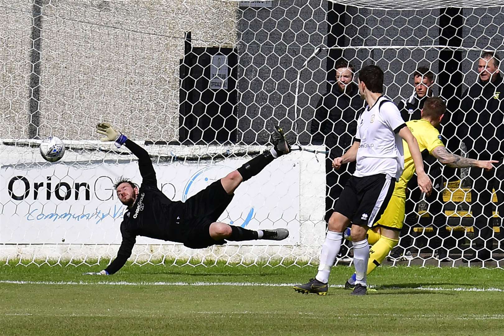 Craig Gunn turns to celebrate as his header beats Clach keeper Douglas Maclennan to open the scoring for Wick Academy during their 2-1 win. Picture: Mel Roger