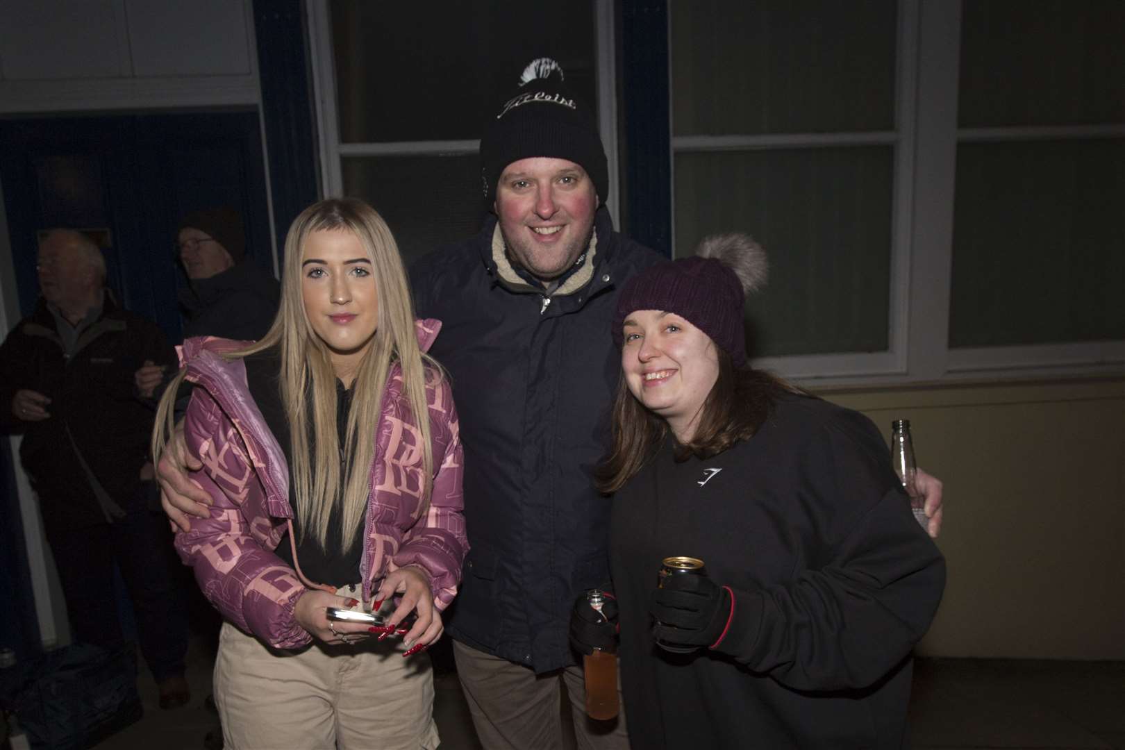 A Happy New Year for a trio of street party goers. Photo: Robert MacDonald/Northern Studios