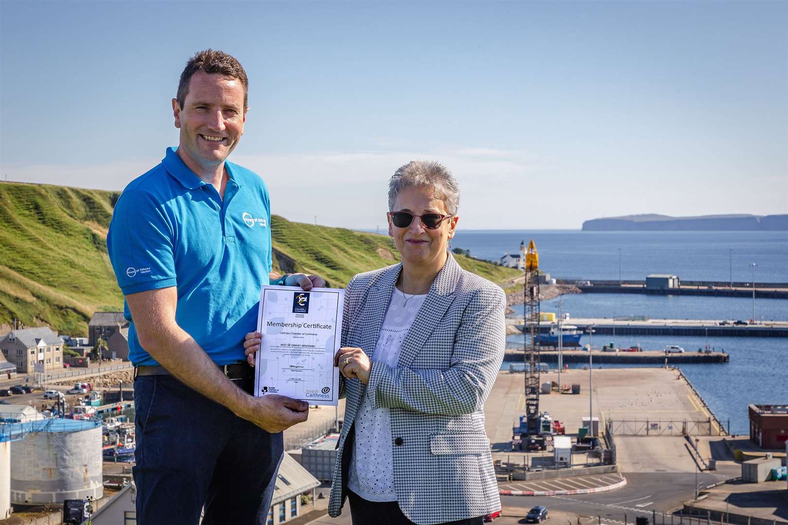 Jack Farnham development manager for West of Orkney Windfarm, with Trudy Morris, CEO of Caithness Chamber of Commerce at Scrabster Harbour.