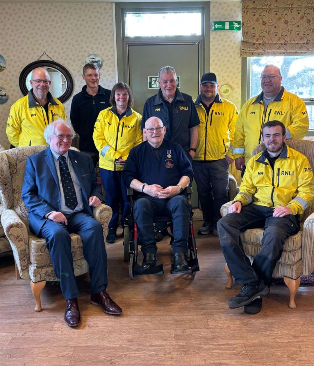 Hamish Steven (centre) with Murray Lamont (front, left), chairman of the Wick lifeboat management group, and others from the local RNLI team.